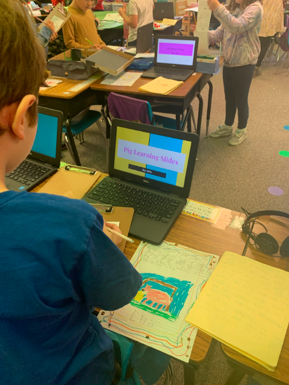 Students offer peer-to-peer feedback during a second grade Exhibition of Learning.